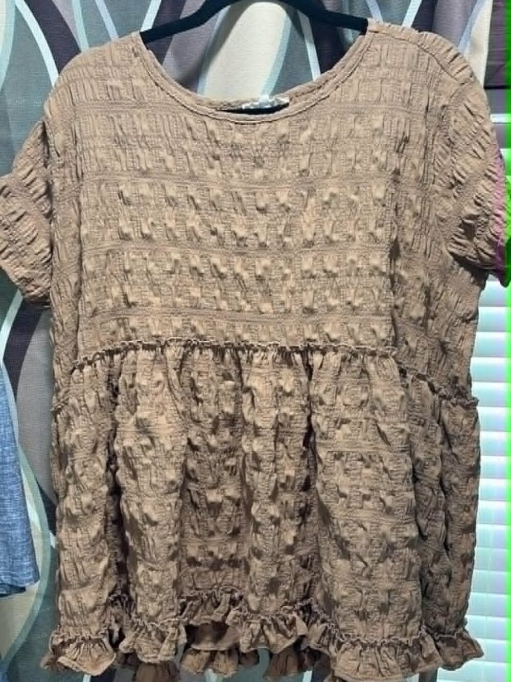Yes, this item is the Entro Boho Babydoll Tunic Top in the shades "Iced Mocha"